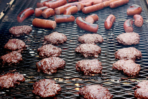 Burgers and Brats on a big Grill stock photo