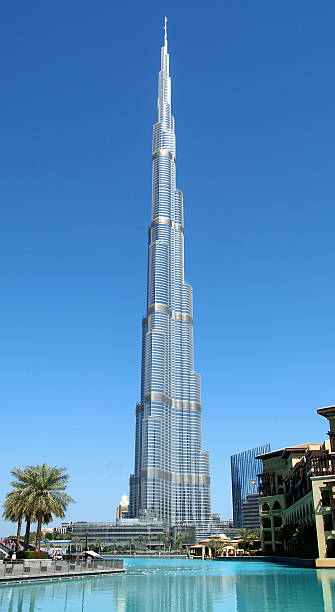Burj Khalifa Dubai, United Arab Emirates – March 2, 2013: A view of the Burj Khalifa with Burj Khalifa Lake in the foreground. burj khalifa stock pictures, royalty-free photos & images