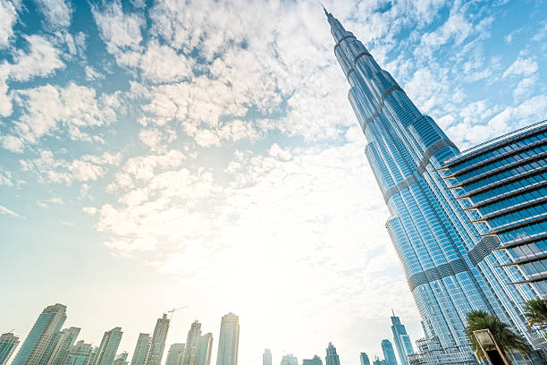 Burj Khalifa vanishing in blue sky in Dubai, UAE. Dubai, UAE - December 8, 2012: Burj Khalifa vanishing in blue sky. It is tallest structure in world since 2010, 829.8 metres. burj khalifa stock pictures, royalty-free photos & images