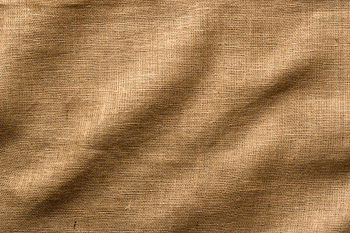 Wrinkled Burlap fabric - use as a Horizontal or Vertical image, lots of texture and detail. Full Frame.