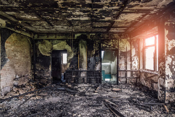 Burned interiors after fire of industrial or residential building. Fire consequences concept stock photo