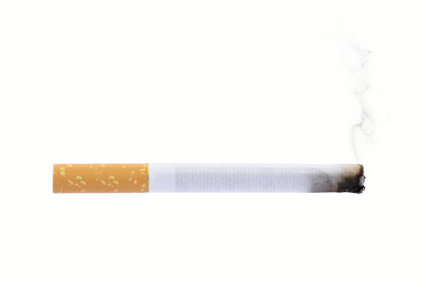Burning cigarette smoke isolated on white background smoking stock photo
