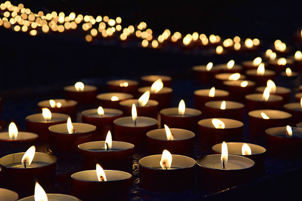 burning memorial candles burning memorial candles on the dark background memorial stock pictures, royalty-free photos & images