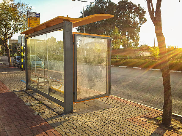 Bus stop flooded by sunset stock photo