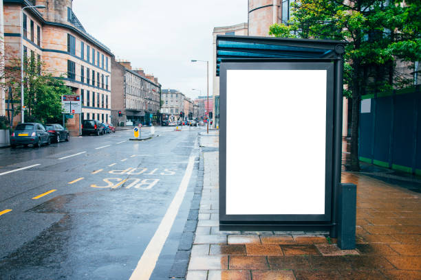 A bus stop with a blank billboard.