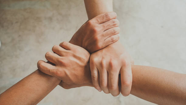 Business background Three human join hands together, collaboration concept of business and education teamwork, soft focus and vintage color tone process three people stock pictures, royalty-free photos & images