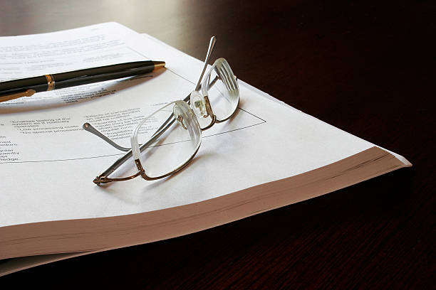 Business Brief, Glasses and Pen stock photo