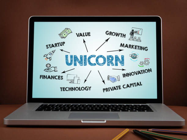 UNICORN, business concept. Laptops on a brown background stock photo