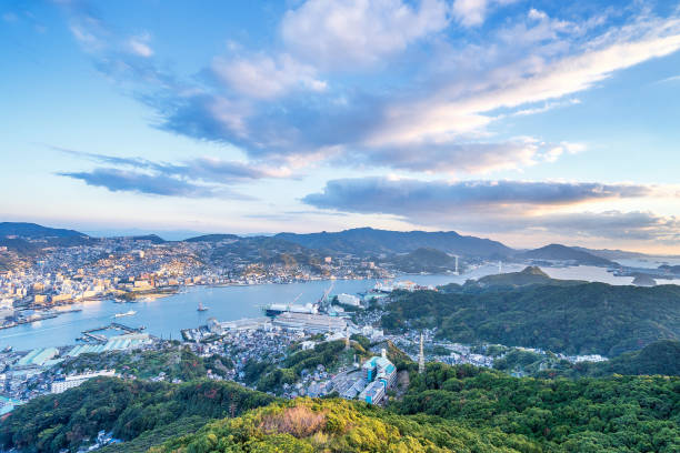 Business concept, modern cityscape of nagasaki dusk from mount inasa, the new top 3 nightview of the world, aerial view, copy space Business concept, modern cityscape of nagasaki dusk from mount inasa, the new top 3 nightview of the world, aerial view, copy space nagasaki prefecture stock pictures, royalty-free photos & images