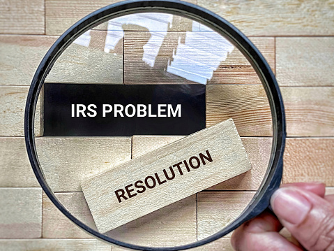 IRS Problem Resolution text background. Stock photo.