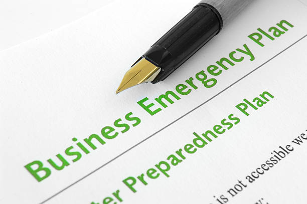 Business emergency plan Close up of pen on business emergency plan emergency response stock pictures, royalty-free photos & images