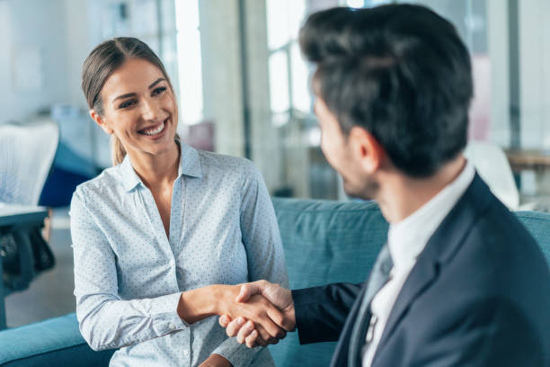 Business handshake Happy Smiling young business persons shaking hands candidate stock pictures, royalty-free photos & images