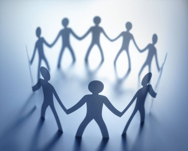 Business Hierarchy Leadership Teamwork Group Group of people, united in the meeting of an organization. Paper cut out in the shape of people. shareholder stock pictures, royalty-free photos & images