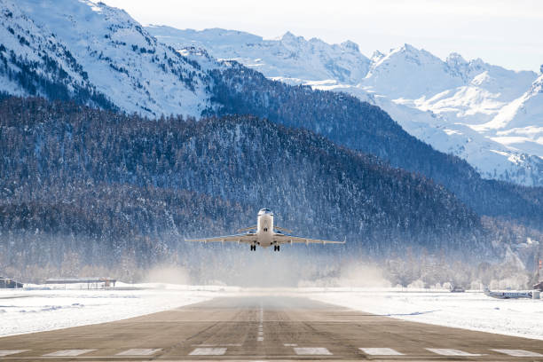 Business Jet Business Jet departing a snowy airfield airfield photos stock pictures, royalty-free photos & images