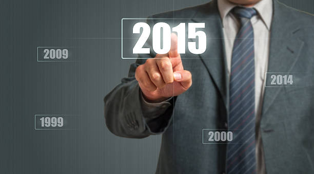 Business Man Choosing 2015 Year Business Man Touching An Imaginary Screen And Choosing 2015 Year 2000 2009 stock pictures, royalty-free photos & images