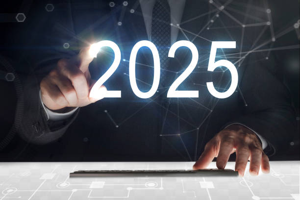 Business man touching screen with "2025" writing stock photo