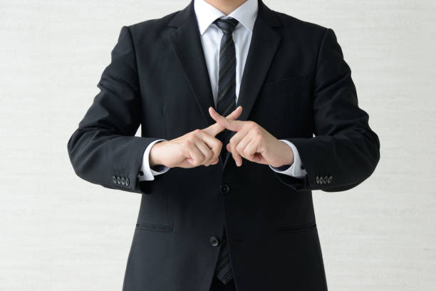 Business man with fingers crossed Business man with fingers crossed failure stock pictures, royalty-free photos & images
