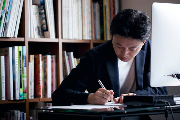 ビジネスの男性自宅勤務 - 勉強　日本人 ストックフォトと画像