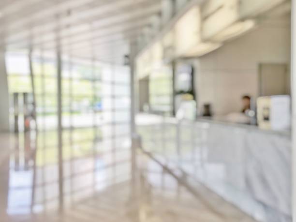 business office lobby blur background of bank reception hall customer or patient counter service and cashier desk inside blurry hospital, office or hotel waiting hall with glass wall window - doctor wall imagens e fotografias de stock