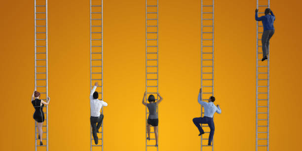 Business People Climbing Ladders stock photo