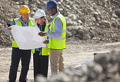 istock Business people reading blueprints in quarry 164852768
