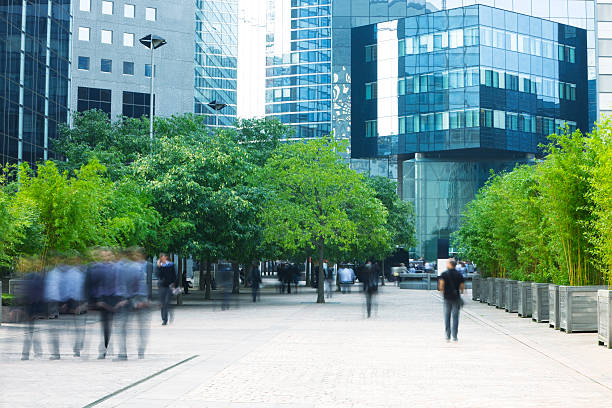 business people walking in modern financial district - finanskvarter bildbanksfoton och bilder