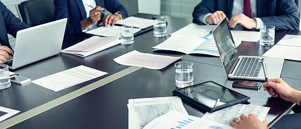 Business people working Business people doing paperwork in office. conference table stock pictures, royalty-free photos & images