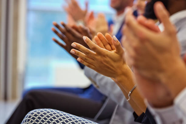 Business seminar, people clapping hands stock photo