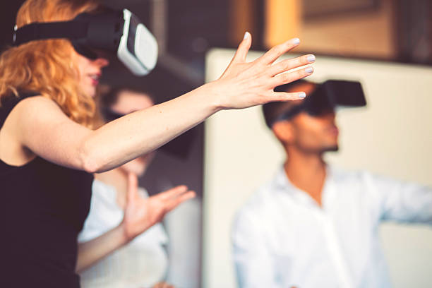 business team using virtual reality headset in the office - vr meeting stockfoto's en -beelden