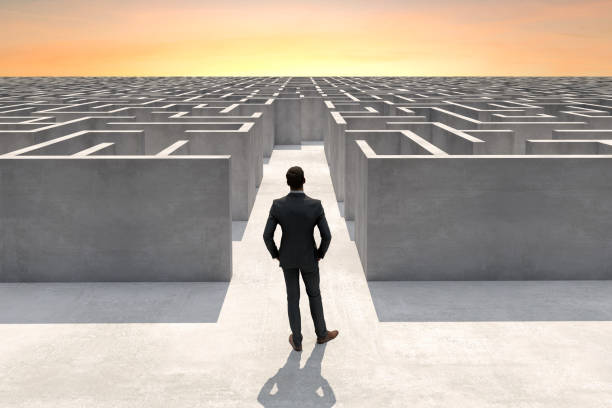 Businessman at the entrance of a complex maze Solution concept with a businessman at the entrance of a complex maze, Digitally Generated Image. maze stock pictures, royalty-free photos & images