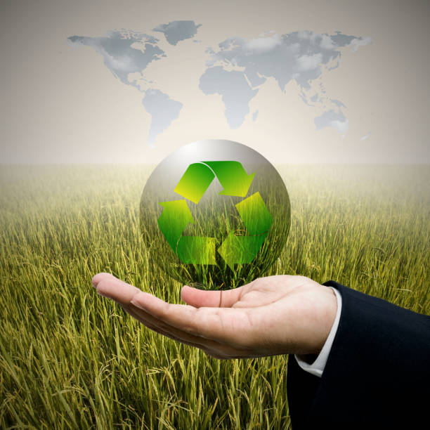 Businessman care recycle  bubble in hand, Sustainable concept stock photo