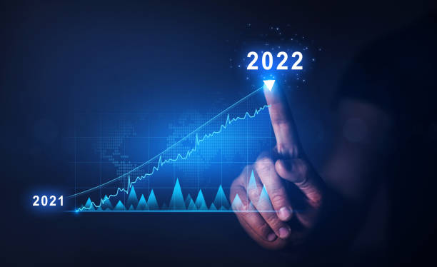 Businessman draws  increase arrow graph corporate future growth year 2021 to 2022.   Planning,opportunity, challenge and business strategy. New Goals, Plans and Visions for Next Year 2022. stock photo