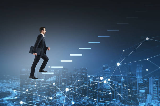 Businessman going up using staircase made from hologram. Singapo stock photo
