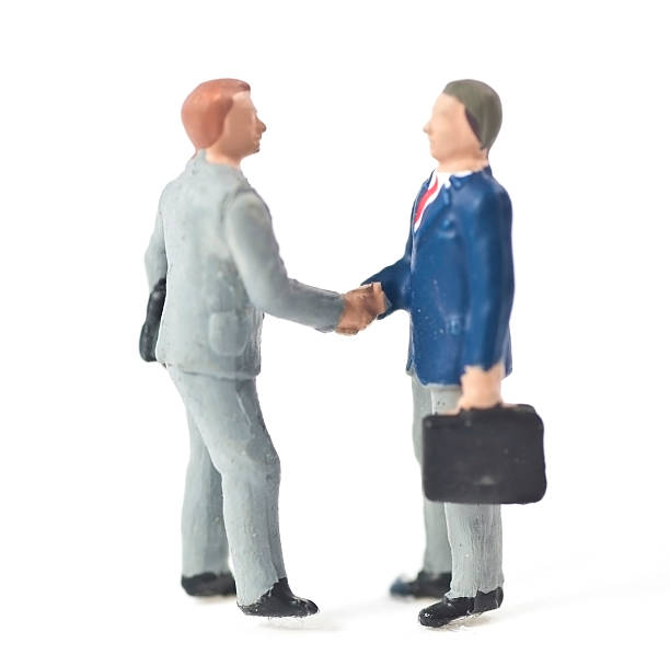 Businessman Handshake  figurine stock pictures, royalty-free photos & images