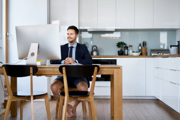 Businessman having video conference while working from home stock photo