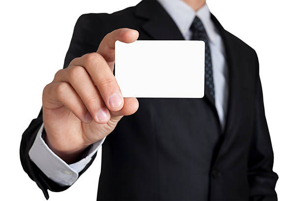 Businessman holding card stock photo