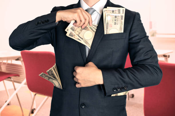 Businessman holding money at the seminar stock photo