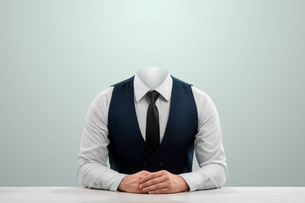 Businessman in a white shirt, vest and headless tie on a light background. Copy space. stock photo