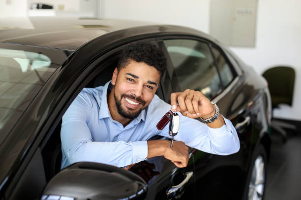 Businessman in his new car stock photo