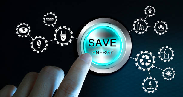 Businessman press save energy button with virtual light in dark background stock photo
