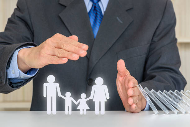 Businessman protects family members e.g parents and two child Family life insurance, financial security concept customer lifetime value stock pictures, royalty-free photos & images