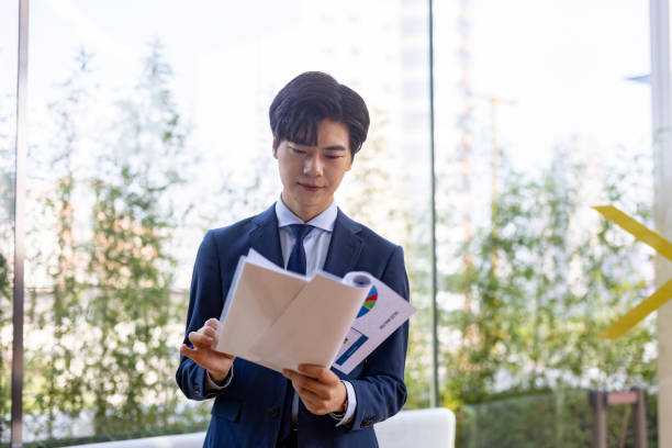 Businessman reading the report stock photo