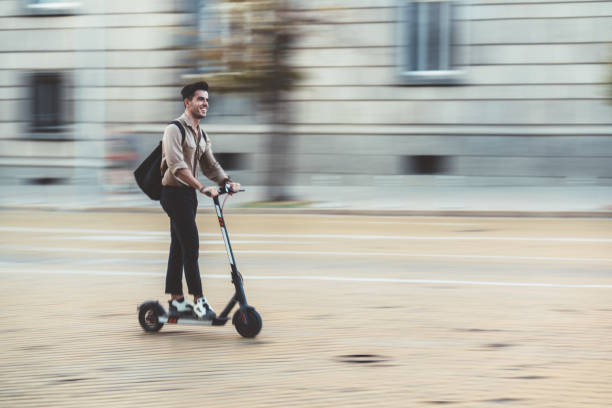 businessman-riding-scooter-in-the-city-picture-id1199895603 (612×408)