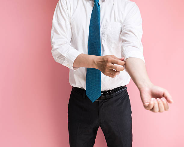 Businessman roll up his sleeves stock photo