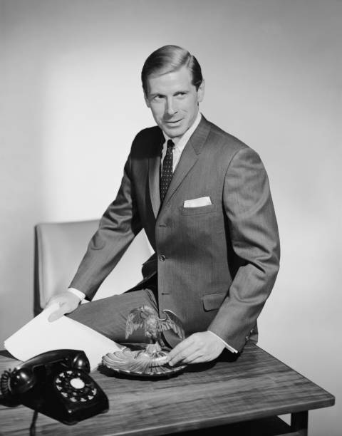 Businessman sitting on table near ash tray  1964 stock pictures, royalty-free photos & images