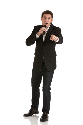 Businessman Speaking Into A Microphone Stock Photo - Download Image Now