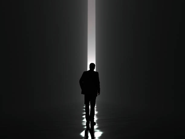 Silhouette Of A Man Walking Away Stock Photos, Pictures & Royalty-Free ... Silhouette Man Walking Tunnel