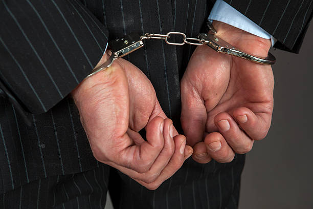 Image result for business man in handcuffs'