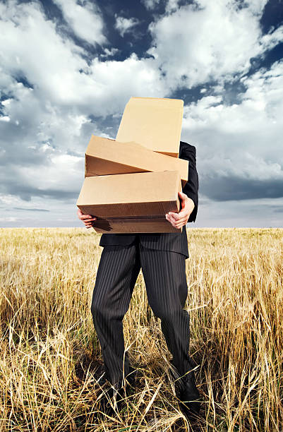 Businessman with boxes stock photo
