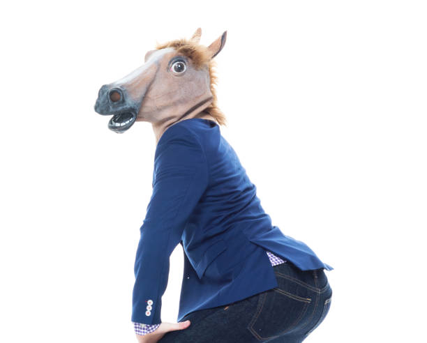Businessman with horse mask is dancing Handsome businessman in blue jacket and wearing jeans horse mask photos stock pictures, royalty-free photos & images